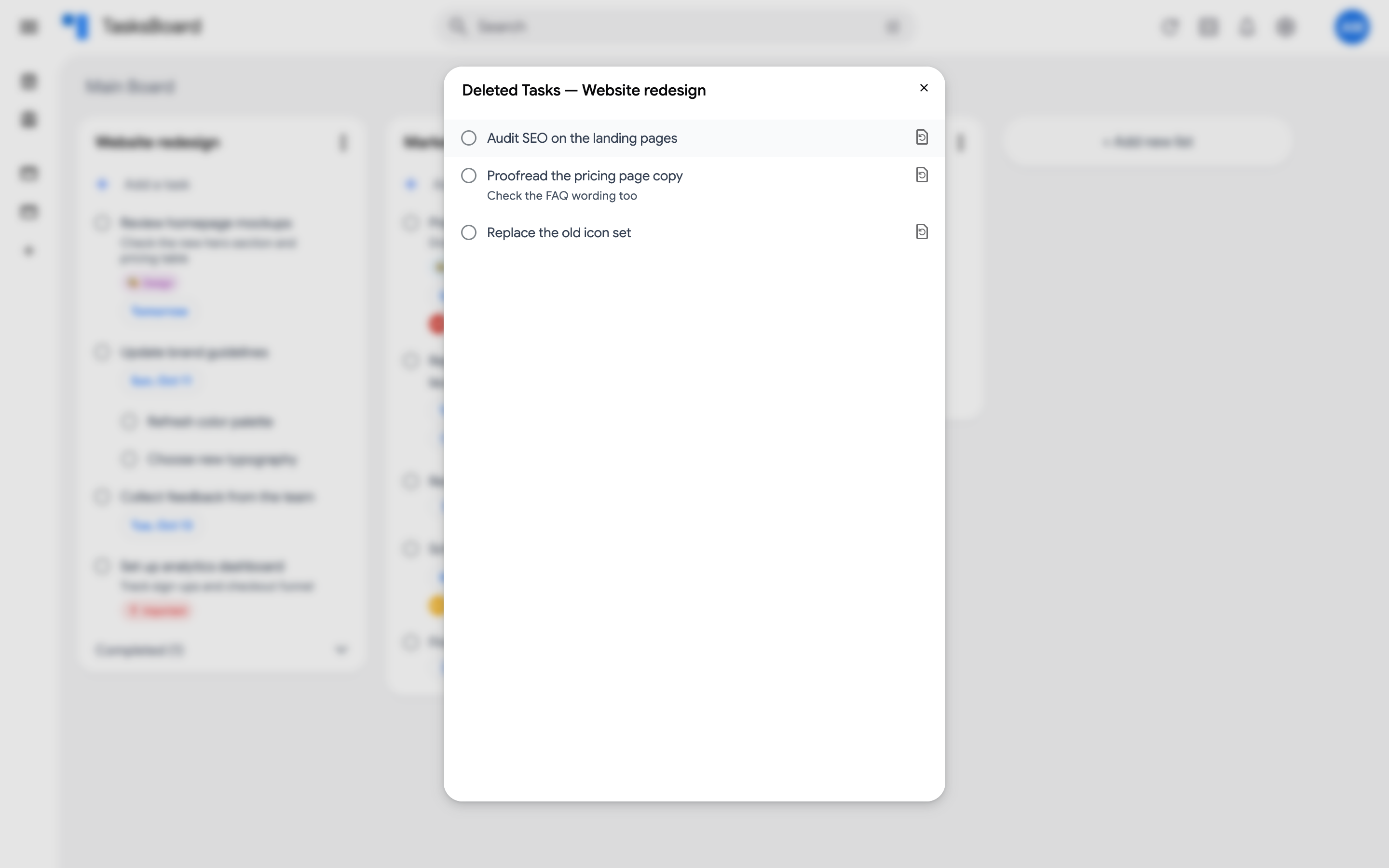 The Deleted Tasks dialog with three tasks and their restore icons